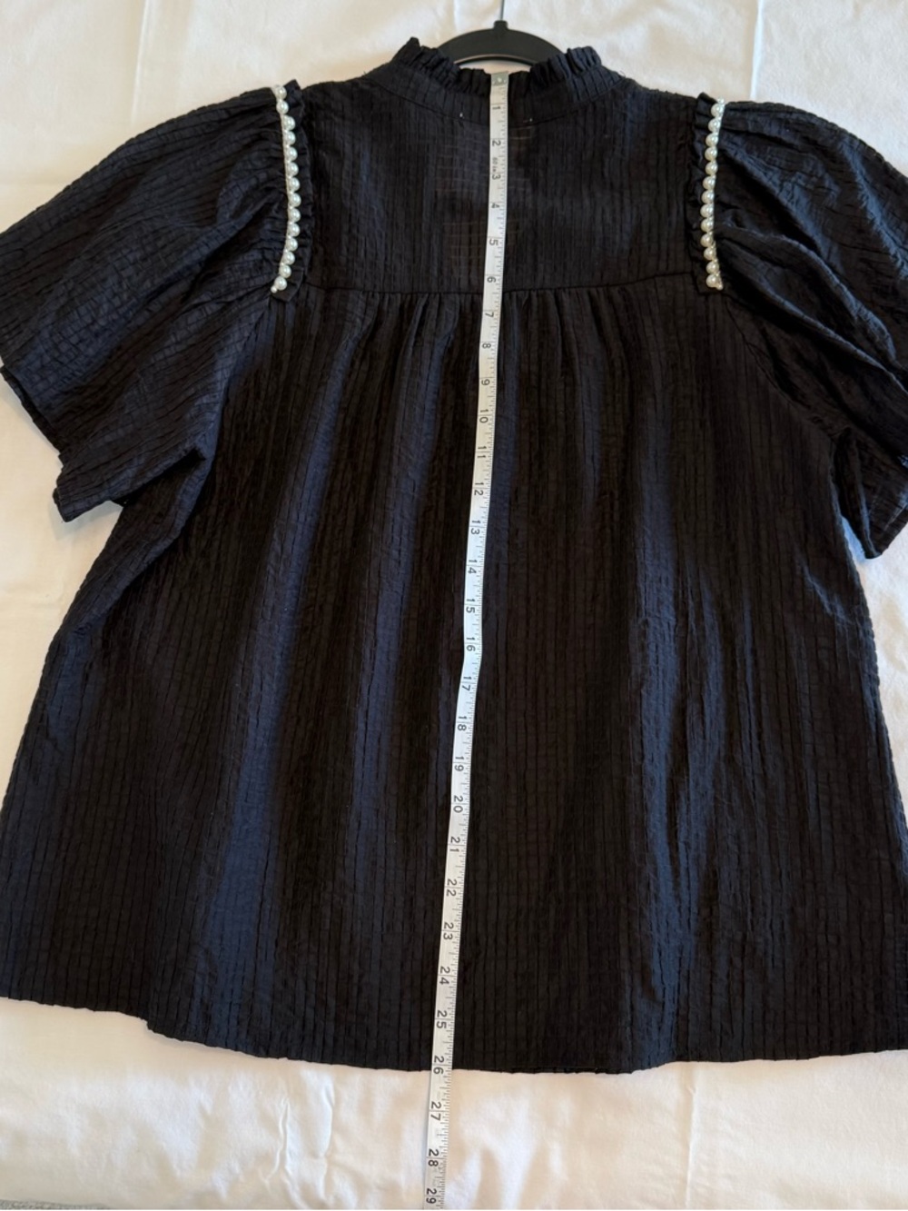 Feminine flowy top from Entro.  Black Ruffle Sleeve Blouse with Pearl Trim - Picture 11 of 14